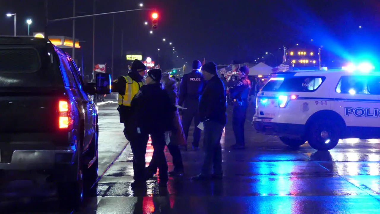 Night shot of Police traffic stop during Freedom Convoy In Canada Police Vehicles with Flasing lights