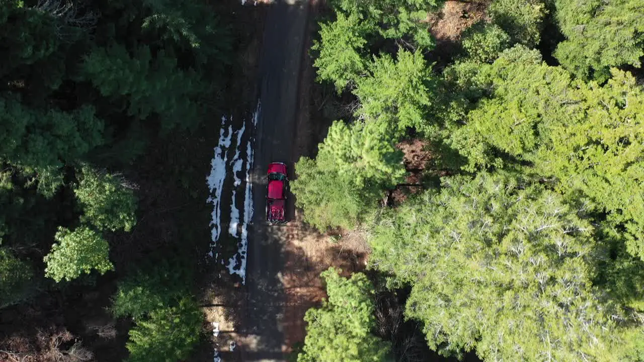 Truck carrying mountain bikes is heading to the top of the trail