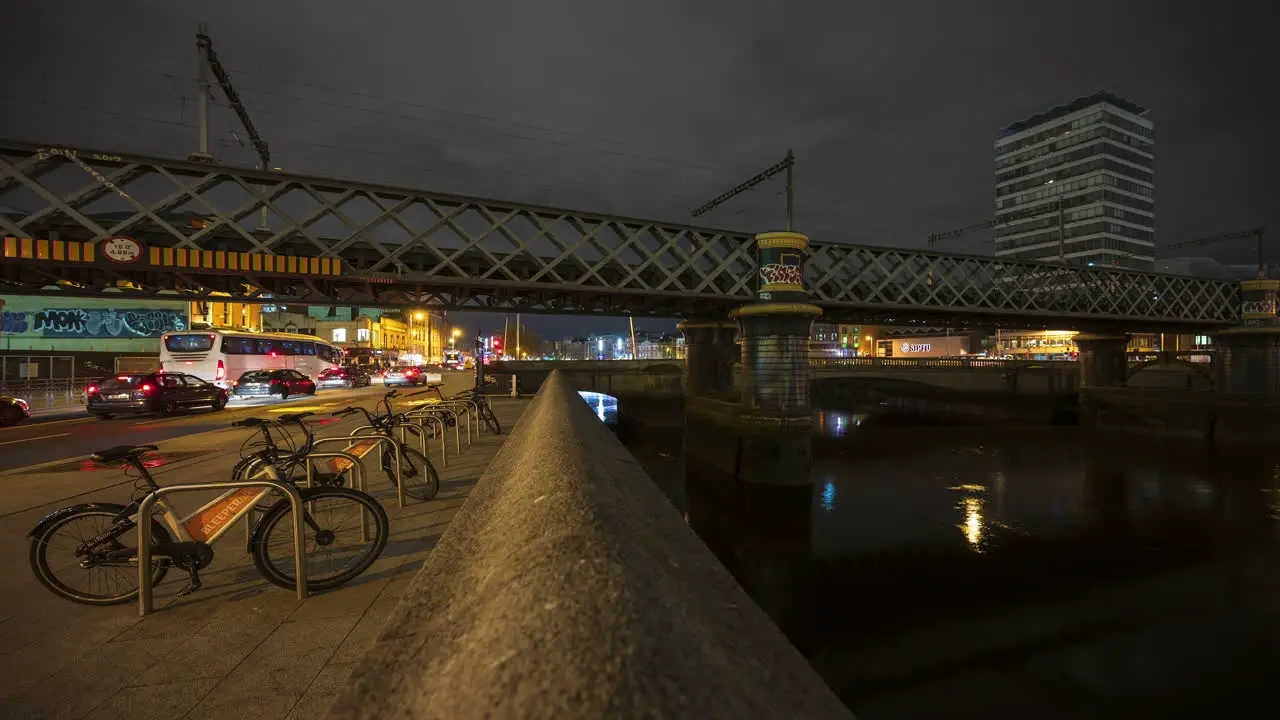 Time lapse of nighttime road traffic and people walking by in Dublin City Centre in Ireland