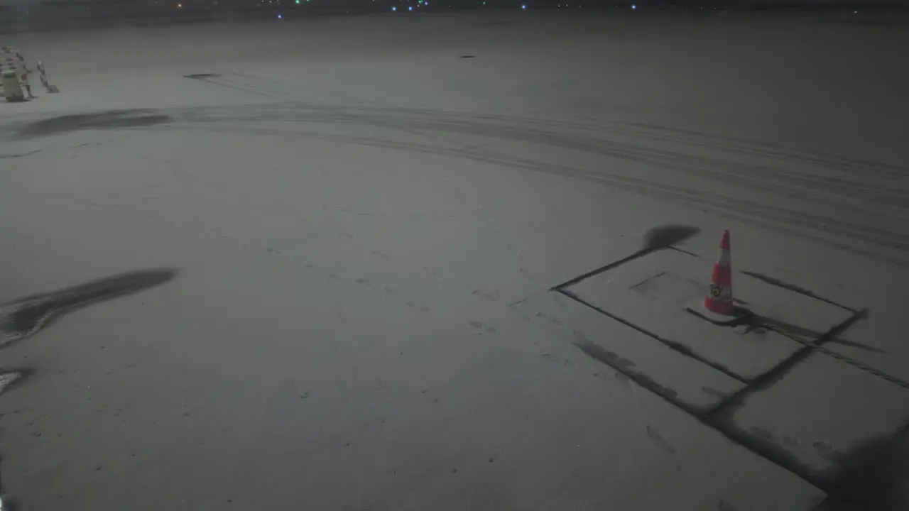 Airport ramp covered in snow camera tilting up