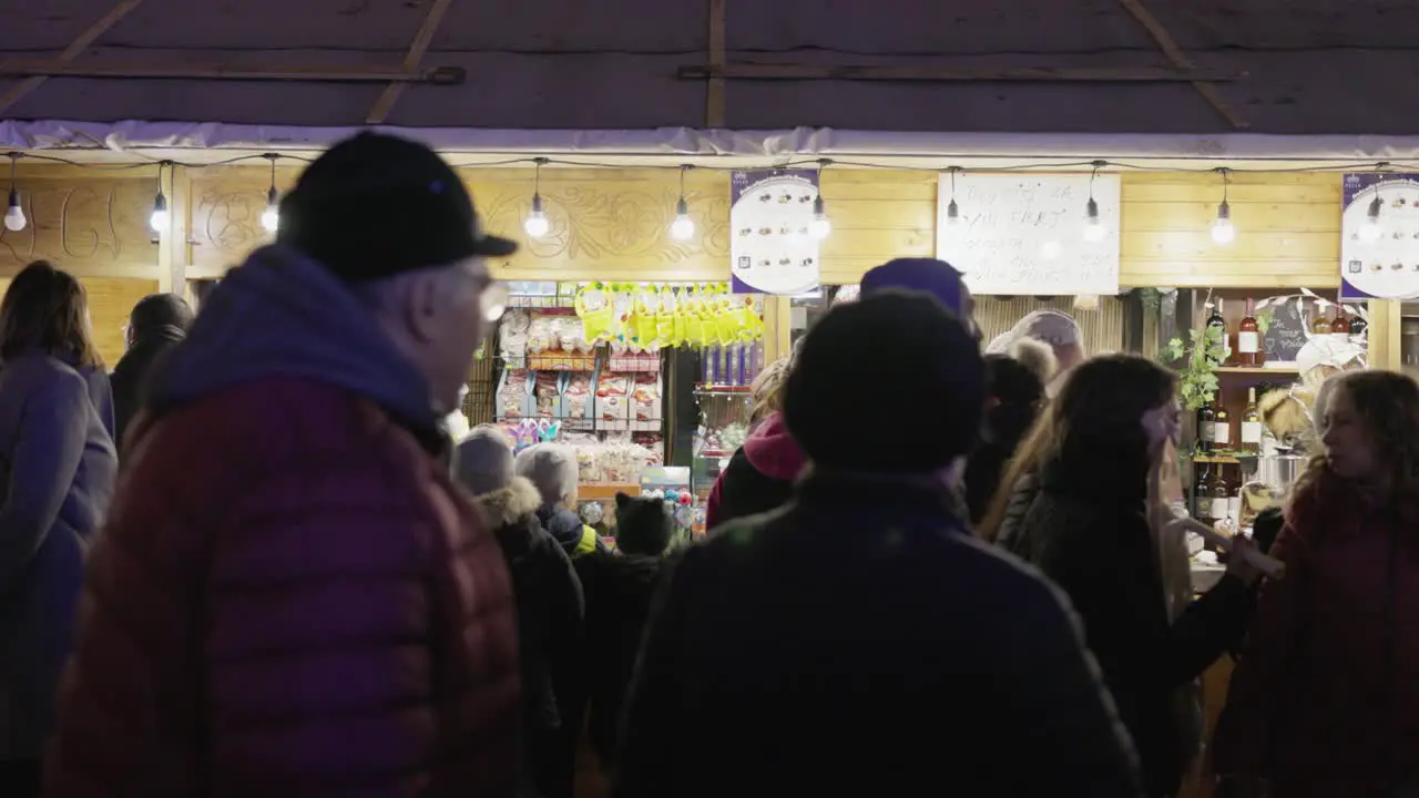 Crowd Of People Wandering Around Food Stalls At Night In Galati Romania