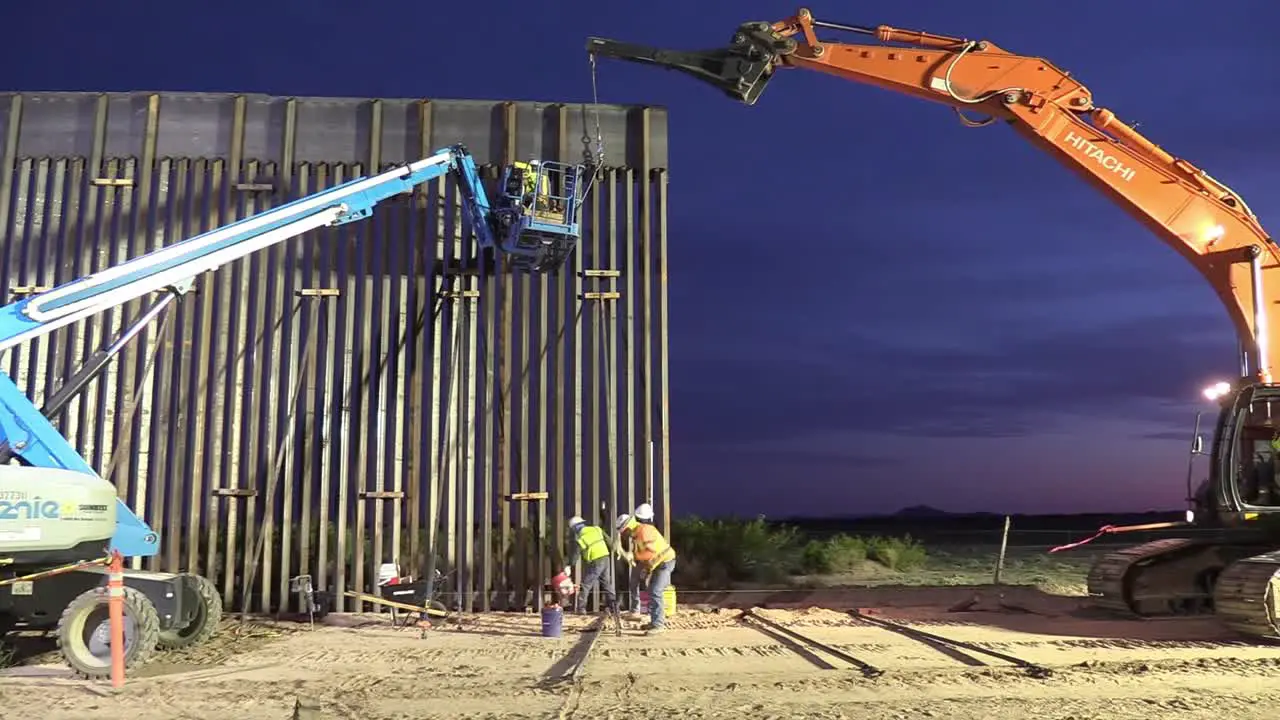 Us Army Corp Of Engineers Installs Section Of Border Wall Or Border Barrier During The Night Near Columbus Nm