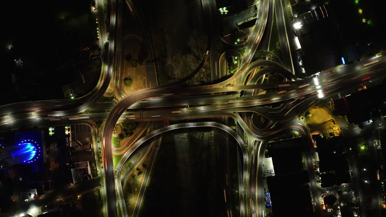 Hyperlapse drone shot top of traffic at a overpass in Monterrey night in Mexico