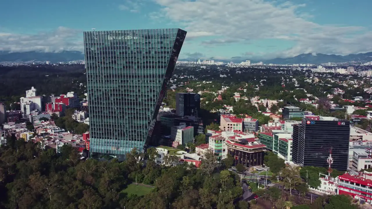 Panoramic lateral track of Virreyes tower in a sunny fall day in Mexico City