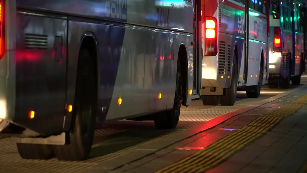 Buses line up to pick up passengers at the Gangnam Bus Station in Seoul South Korea at night