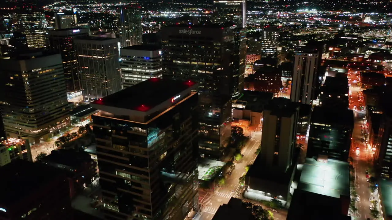 Aerial view over illuminated high-rise in Denver city night in Colorado USA