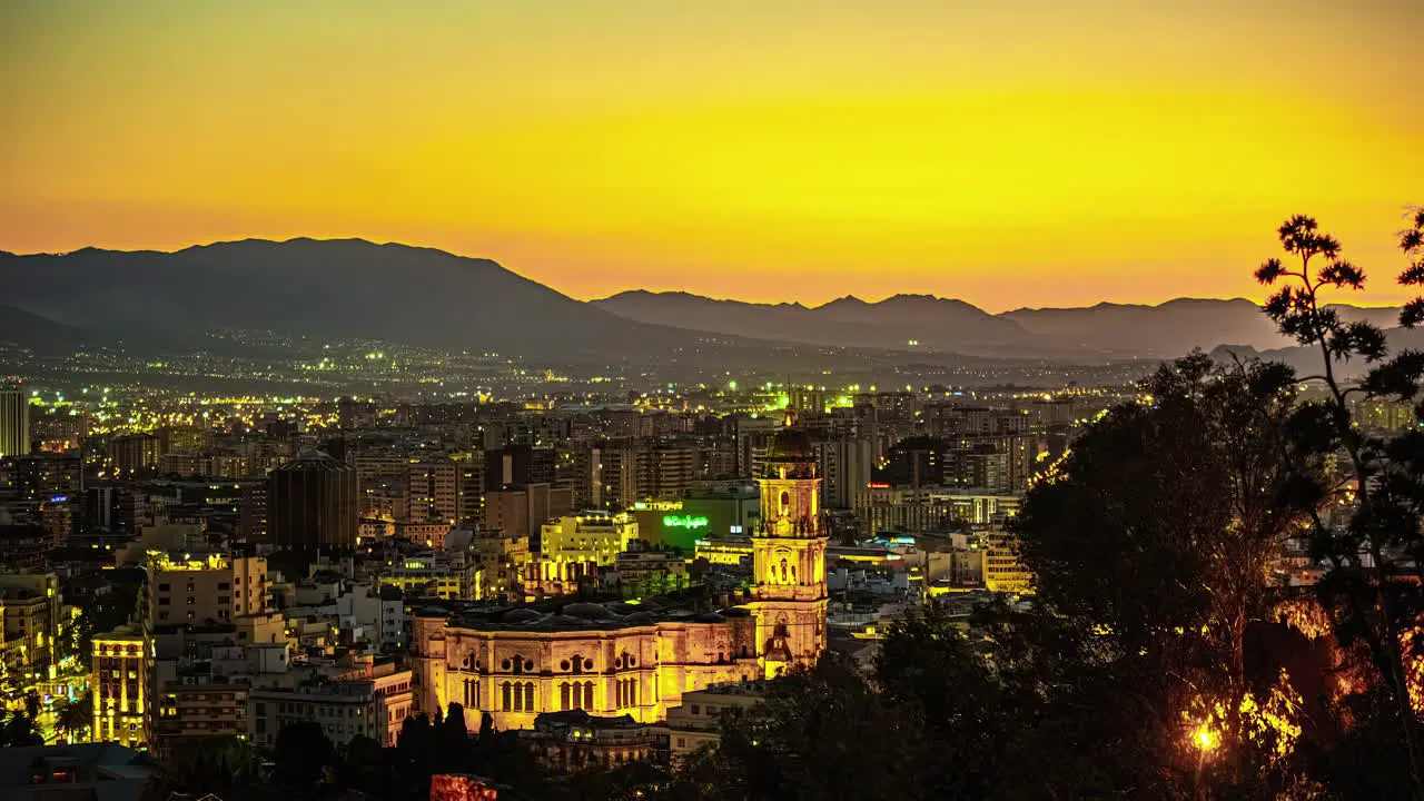 Sunset time lapse of the Port of Malaga Spain including the Incarnation Cathedral