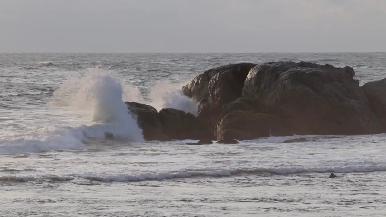 ocean wave Crashing on to rocks in evening Galle fort Seashore Slow motion b roll clip