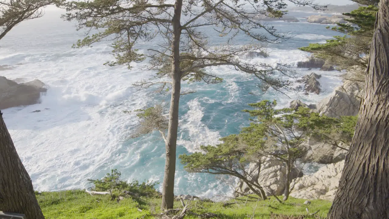 Stationary shot of Waves rolling through the pacific ocean while the tide recedes at Big Sur California beach