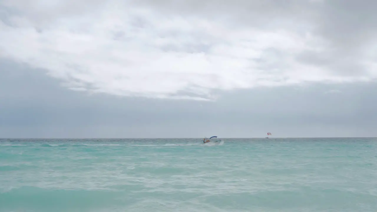 Beautiful Caribbean ocean with blue waters and a boat passing by