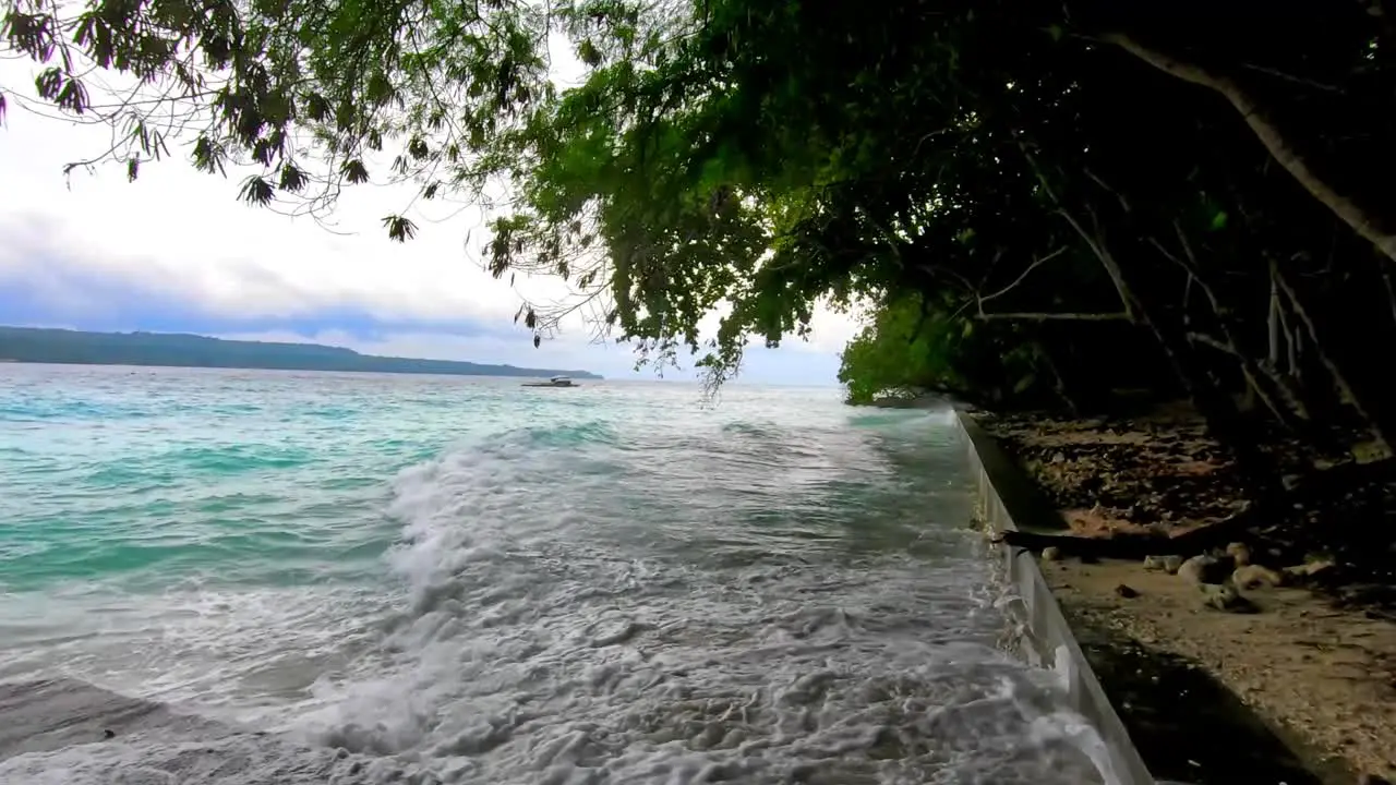 continuous huge waves of blue waters splashes into the blocks