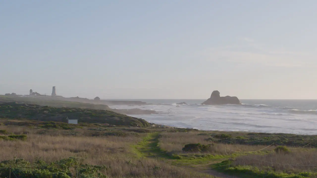 Stationary shot of misty morning waves in the Pacific Ocean located in Big Sur California