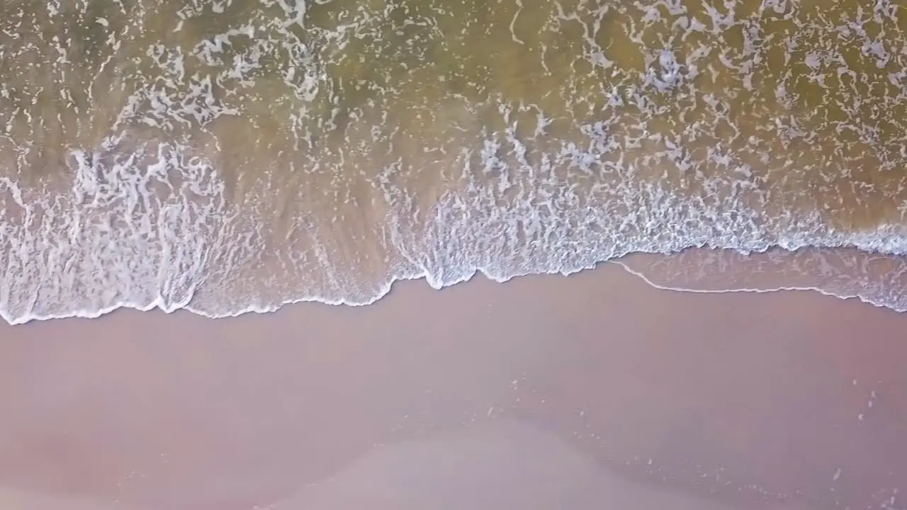 Aerial View Of Sea Waves On Sandy Beach Of Baltic Sea