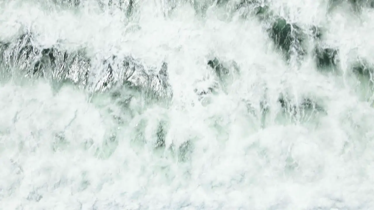 Big waves crashing on surfers in South Africa