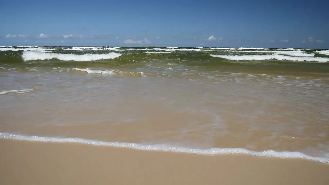 Waves Rolling on Sandy Beach