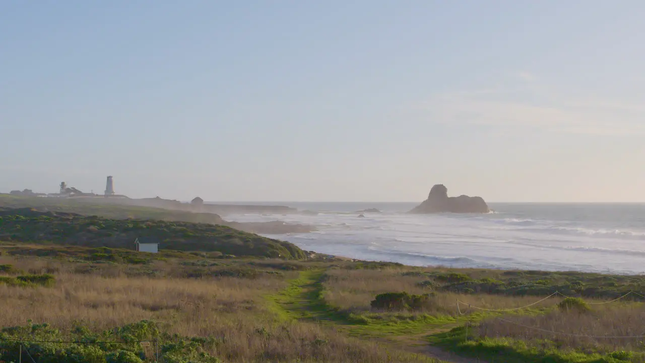 Time lapse of waves rolling into the grassy shores of Big Sur Beach located in Southern California