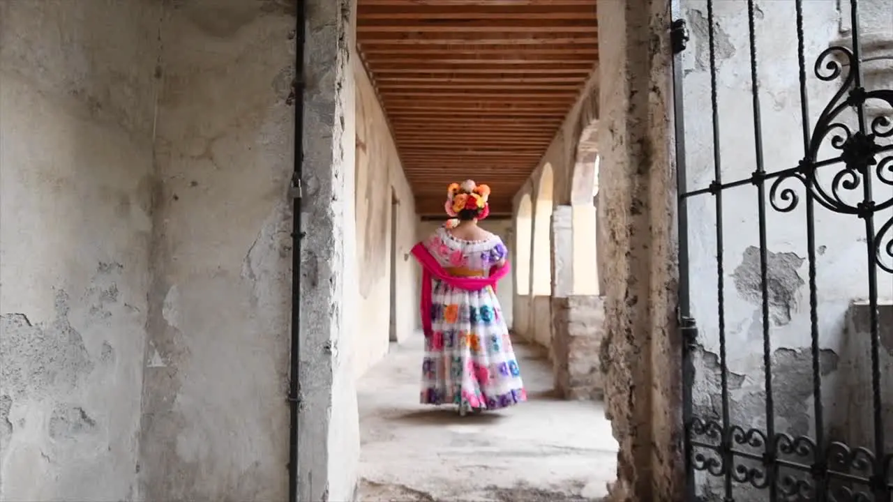 Catrina woman for day of the dead walking in old house