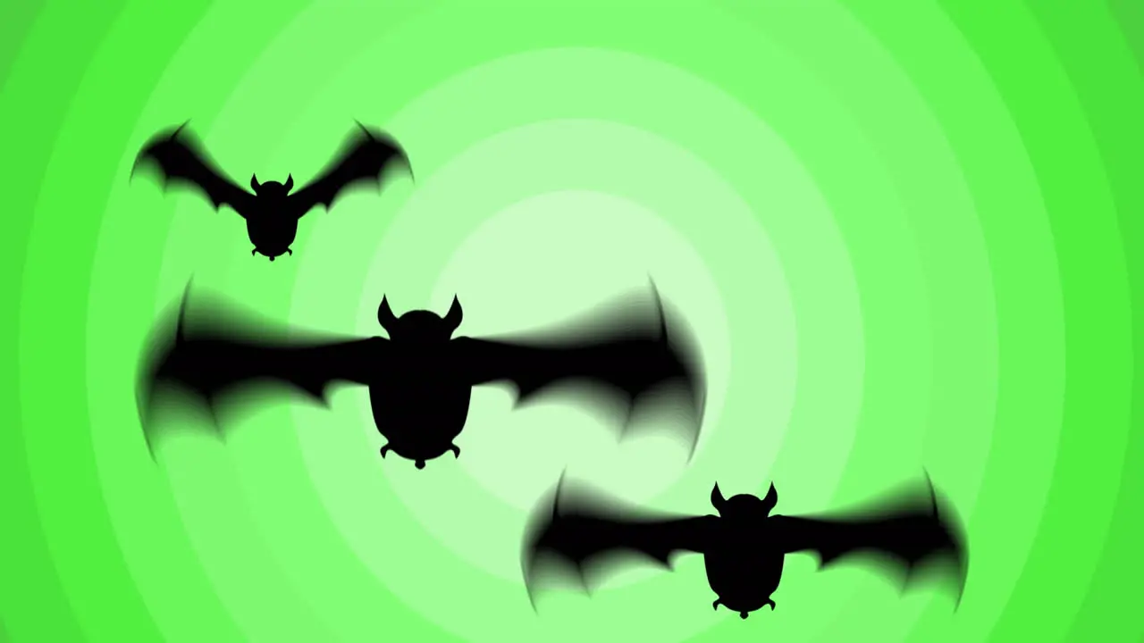 Animation of three black bats flying over green concentric rings