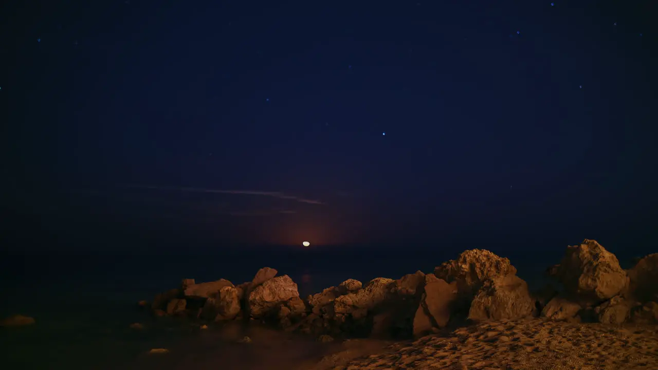 Epic Moon Rising Over The Sea There Is A Moon Track Stars And Falling Meteorites 4k Timelapse Video