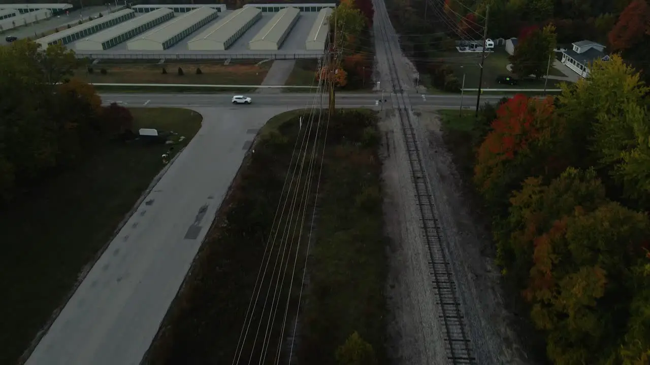 Reverse motion track and tilt over a rail road in Autumn