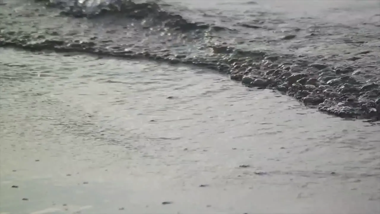 close up of slow motion water waves on the beach