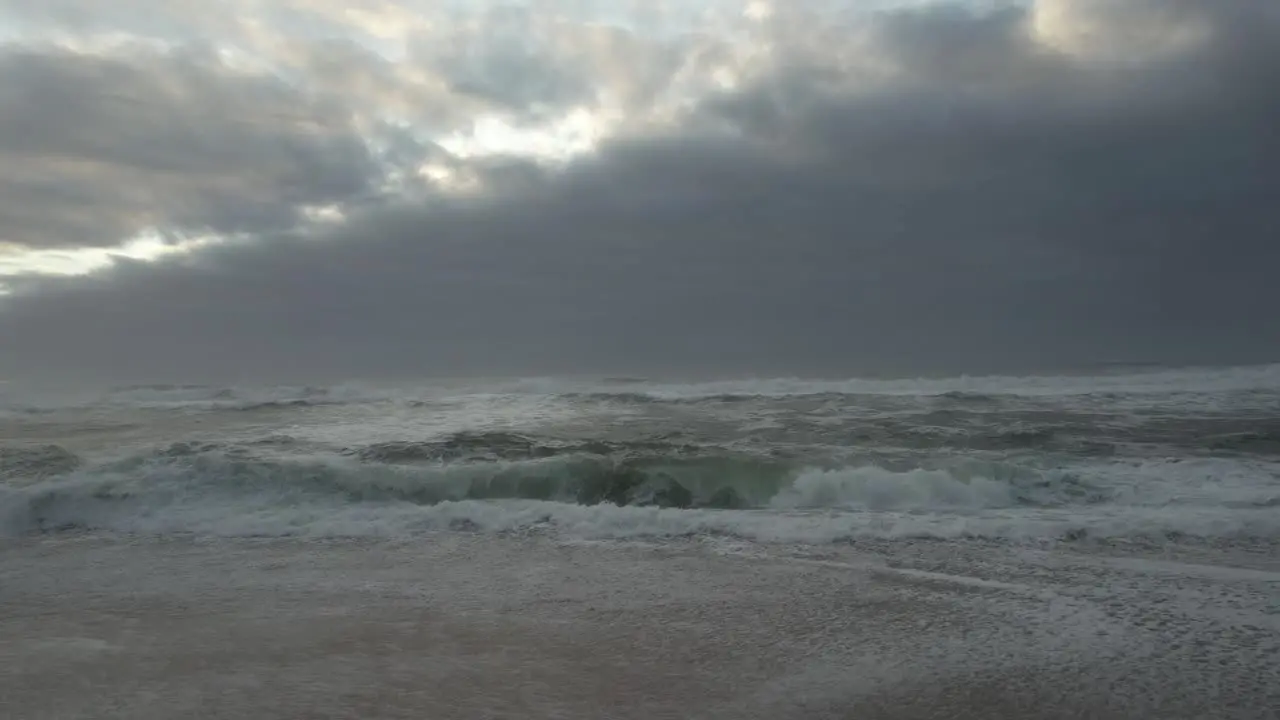 Storm Waves on Beach at Sunset