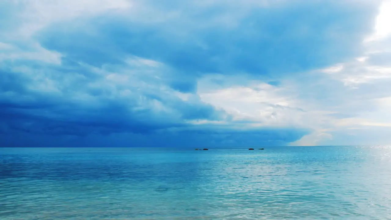 Caribbean sea rippling gently in calm before the storm with cloudy sky