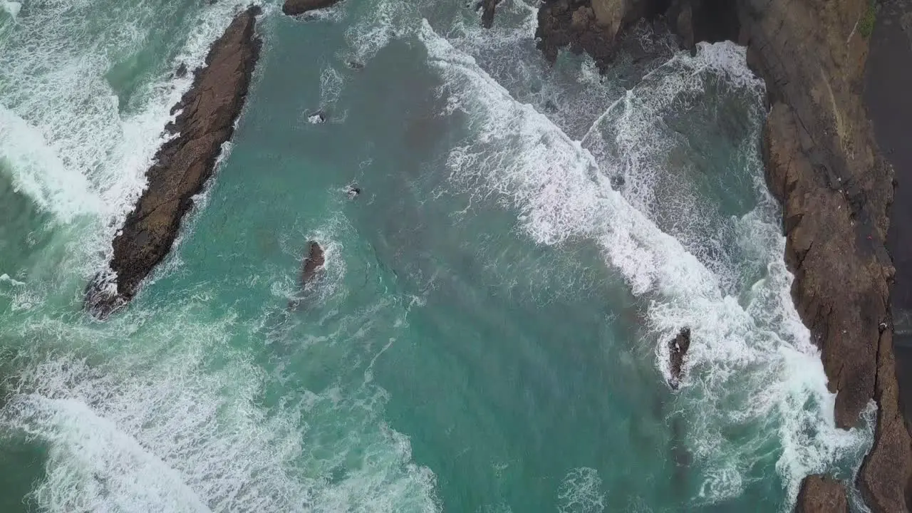 Birds eye view of rocks and cliffs at Karekare Beach in New Zealand