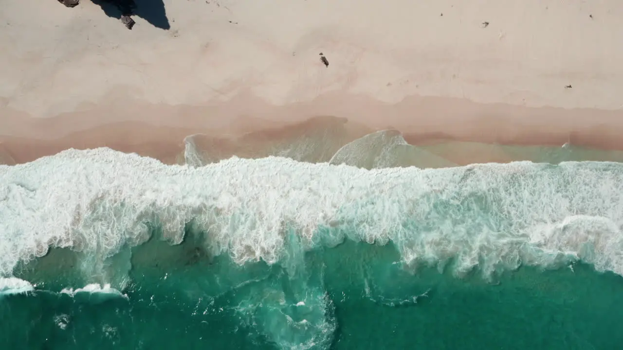 Ocean Waves On Sandy Shore Of Diaz Beach In Summer