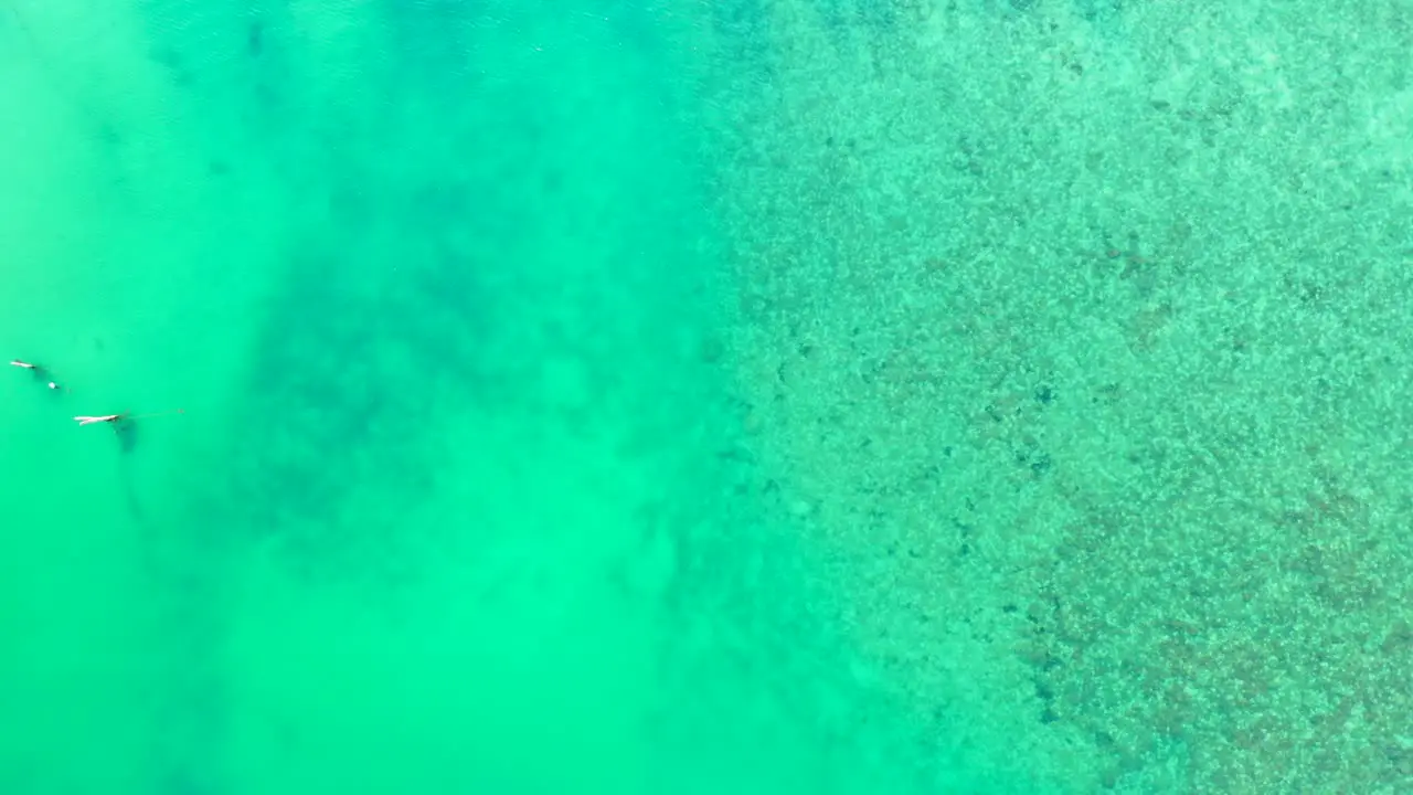 Boats floating in azure sea water