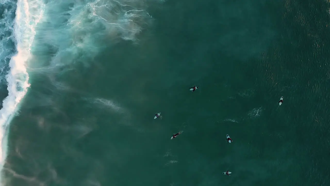 Surfers And Waves In Ocean At Llandudno Cape Town aerial top down