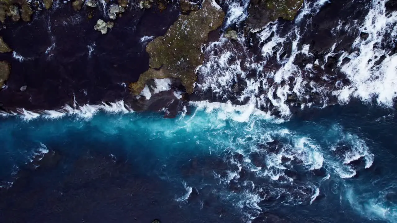 Aerial top down of Hraunfossar waterfall and Hvita river in western Iceland