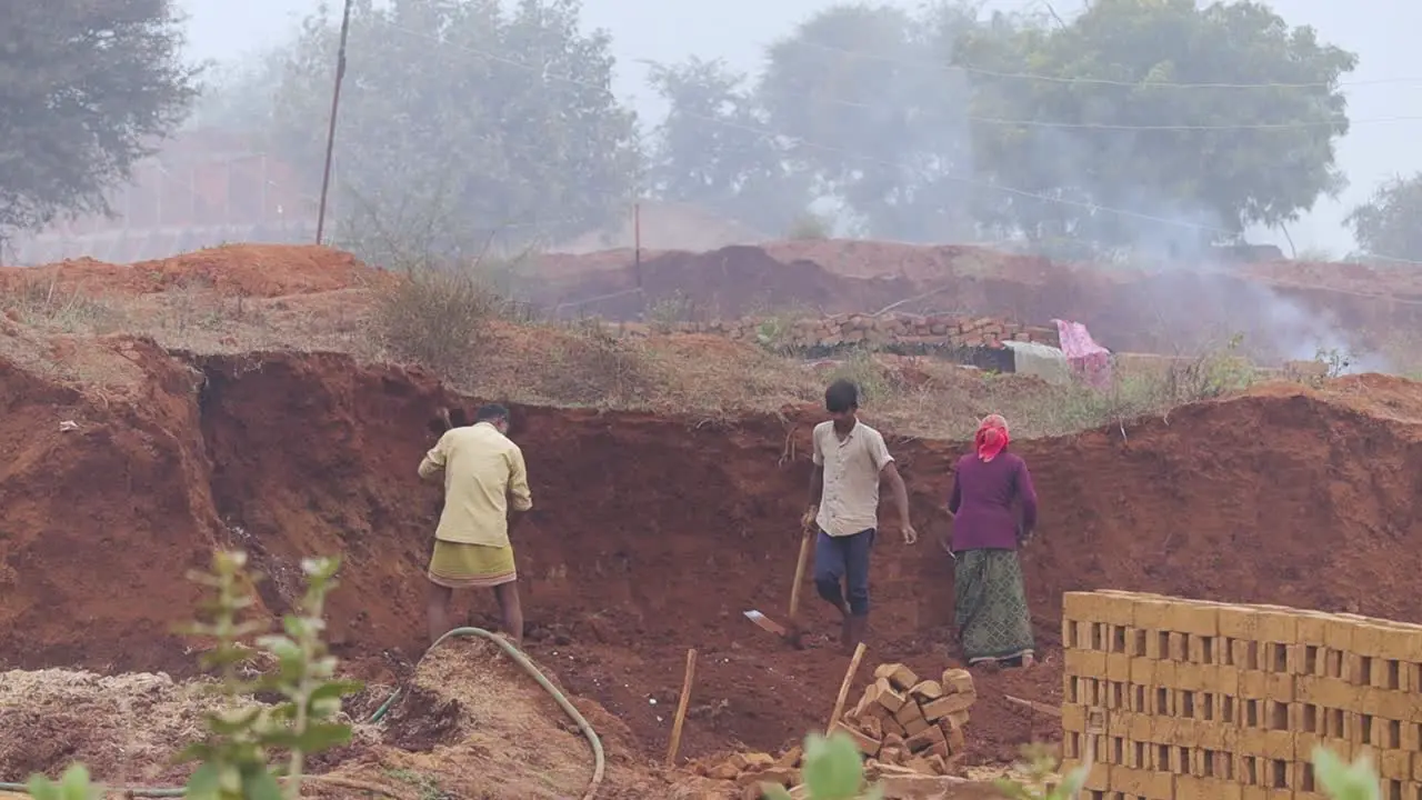 Workers collecting soil for Brick making at a klin in a rural village of Central India