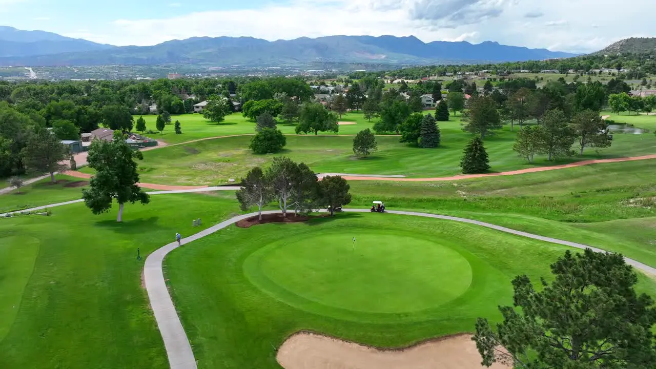 Golfers enjoying luxurious country club course in Colorado