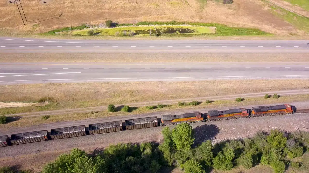 Train passing by the frame with coal