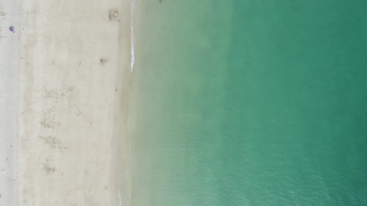 Vertical Shot Of Turquoise Ocean With Sandy Seacoast At St Ives Bay In Cornwall United Kingdom