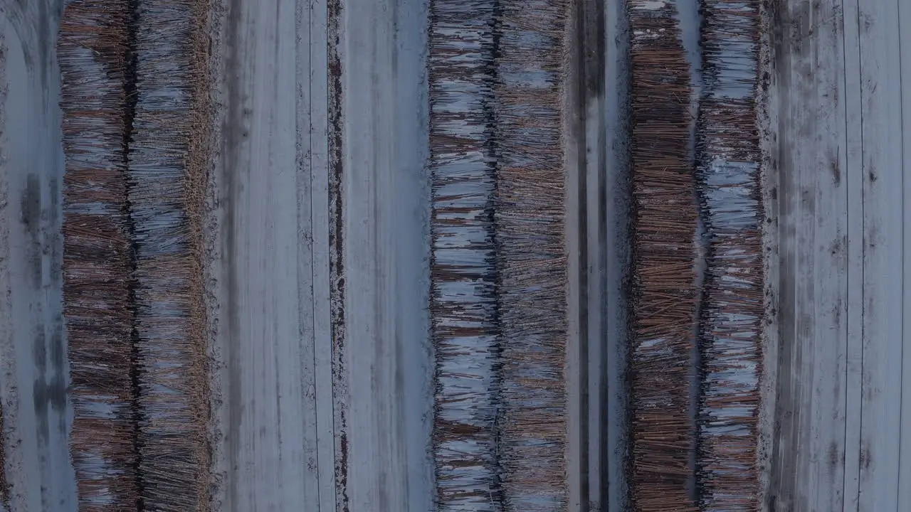 Cinematic graphical aerial plan view of stacked timber