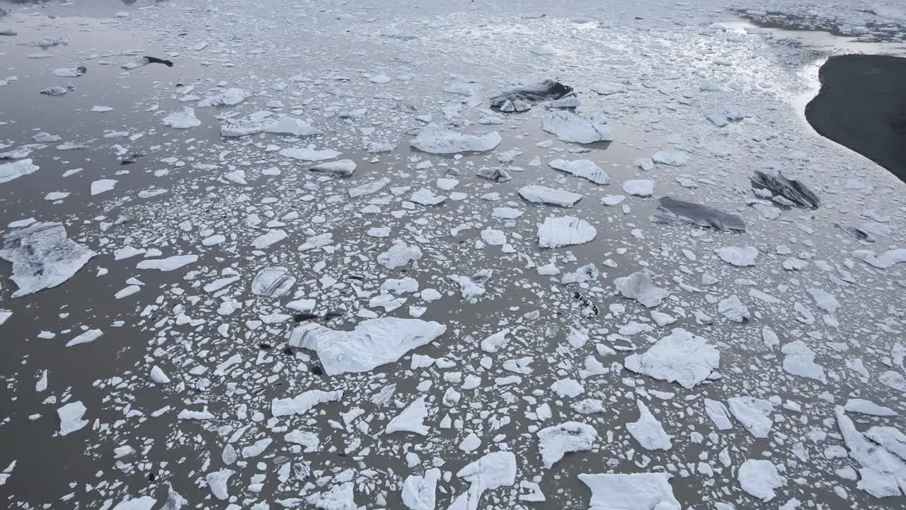 Frozen sea near snowy mountains