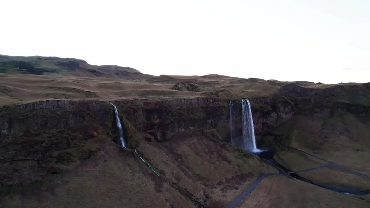 Mystical waterfall Seljalandsfoss in volcanic mountain panorama aerial