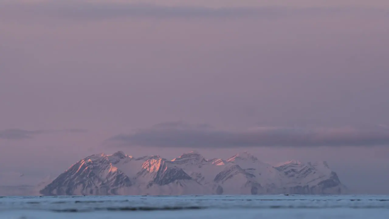 Timelapse of peaky moutain range during sunset