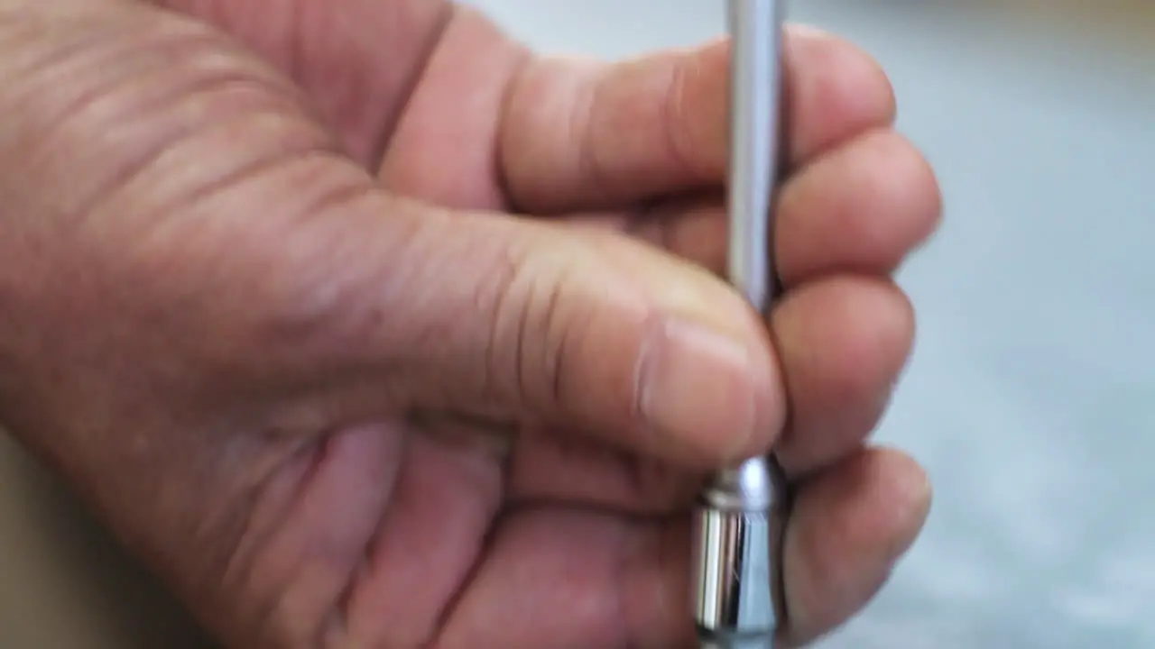 Carpenter using screwdriver to tighten in screw in Kamakura Japan