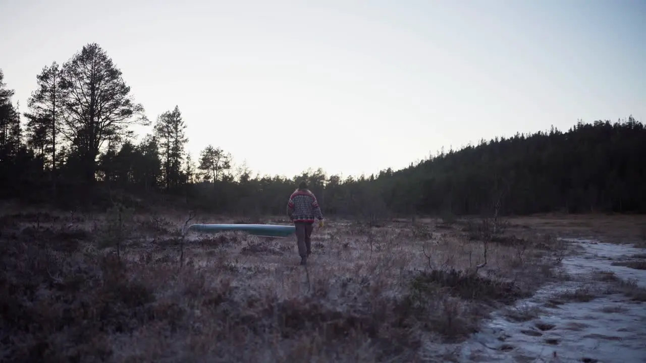 A Man is Strolling Through the Farm Close to the Woods Static Shot