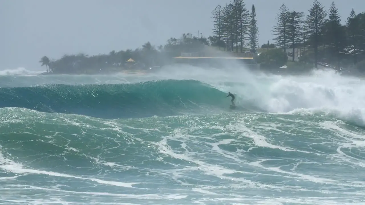 Surfers on Rough Ocean Waves Surfing on Coastline of Australia Greenmount Beach Queensland