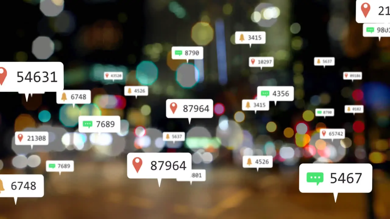 Animation of social media icons floating against blurred view of night city traffic