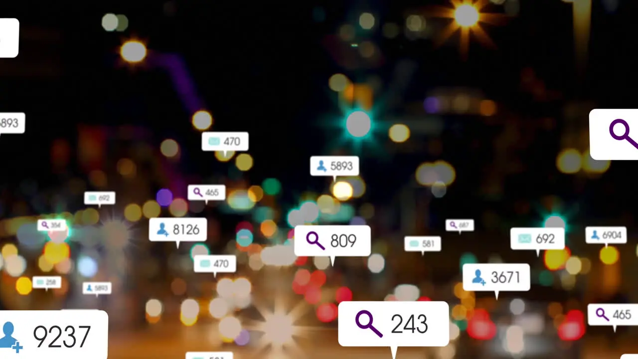 Animation of social media icons against blurred view of night city traffic