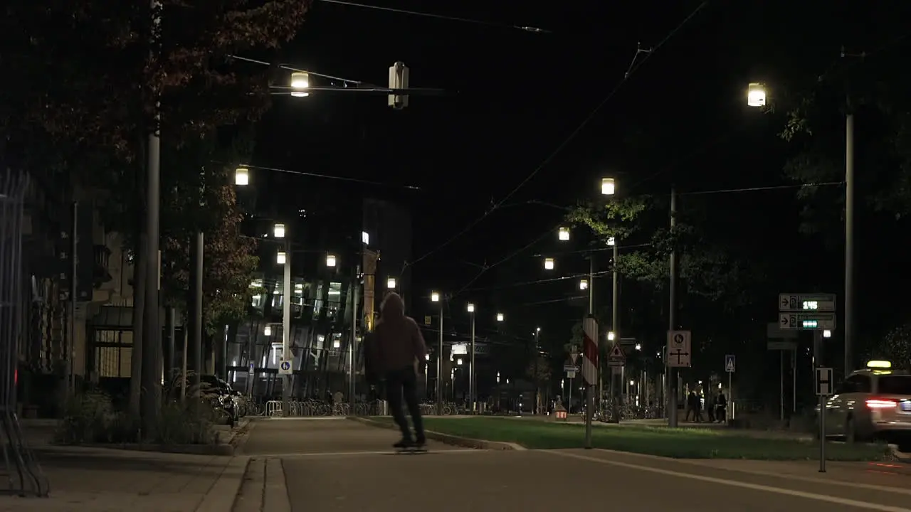 Skateboarding trough empty city at night