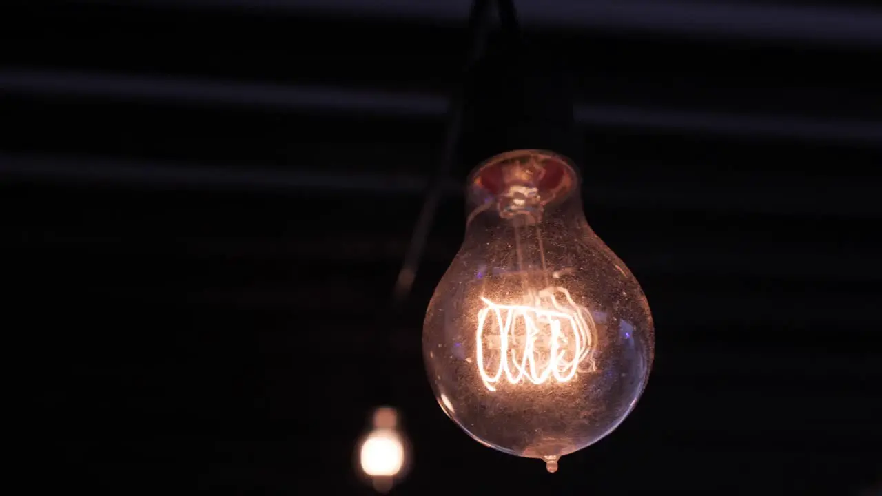 A Lightbulb hanging in the dark