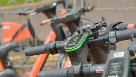 Tracking Shot Passing Over Handlebars of Electric Scooters