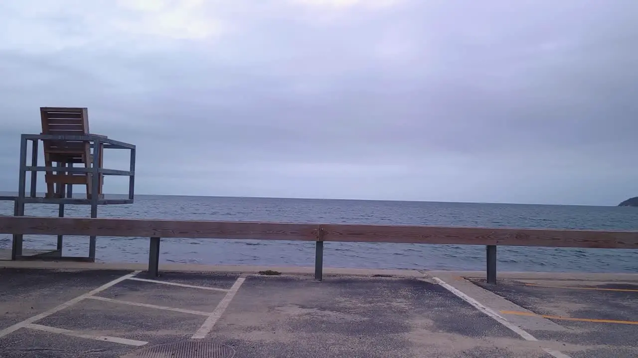 Empty chair seaside waterfront looking at the ocean