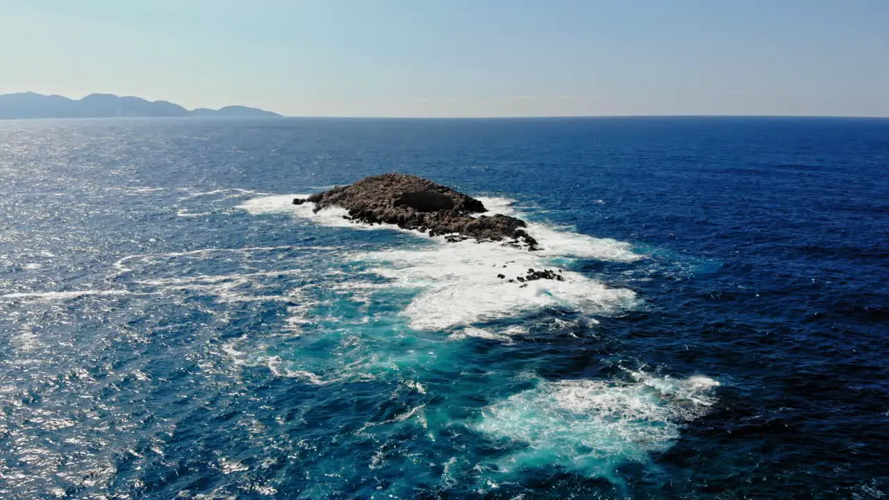 Idyllic Seascape With Blue Water And Foamy Waves In Jerusalem Beach Erisos Greece aerial drone shot